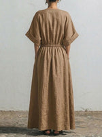 Wrap-style V-neck Cotton-linen Maxi Dress With Wooden Buttons, Batwing Short Sleeves, And A Fitted Waist.