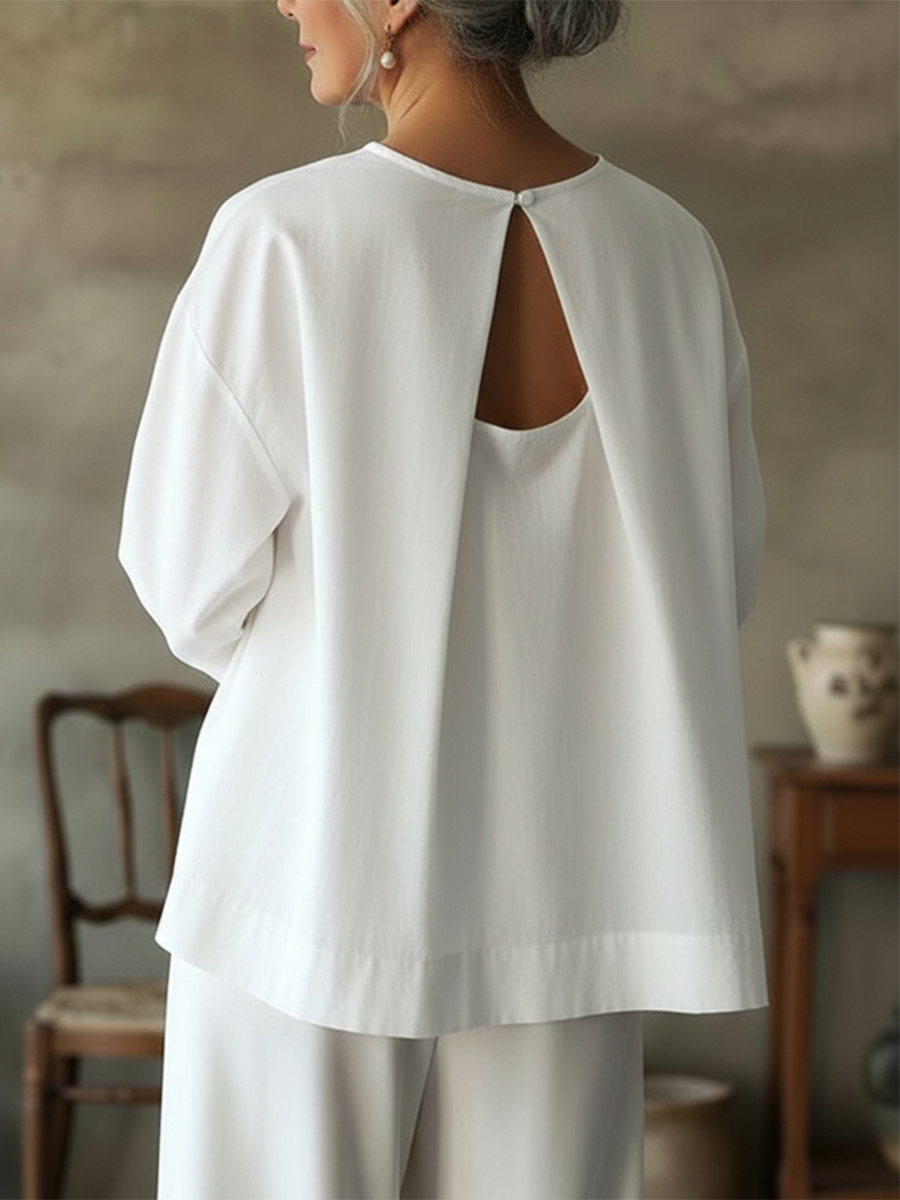 Elegante top senza schienale in 100% cotone.