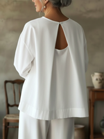 Elegante top senza schienale in 100% cotone.