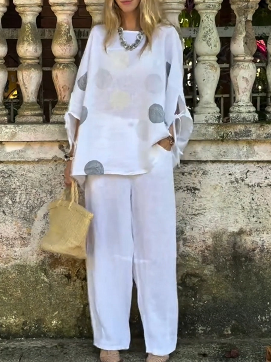 Two-piece Set Featuring A Loose, Casual Polka-dot Print Linen-cotton Top And White Trousers.